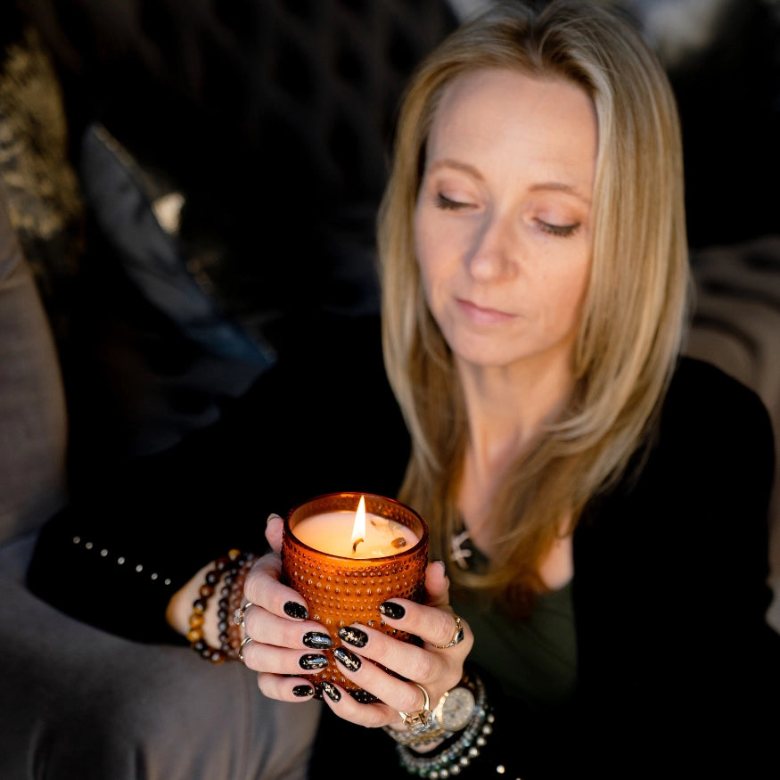 Rebekah holding the Align magnetic candle from the evoline
