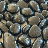 The Evoline Black Tourmaline Protection and Grounding Tumbled Stones. 