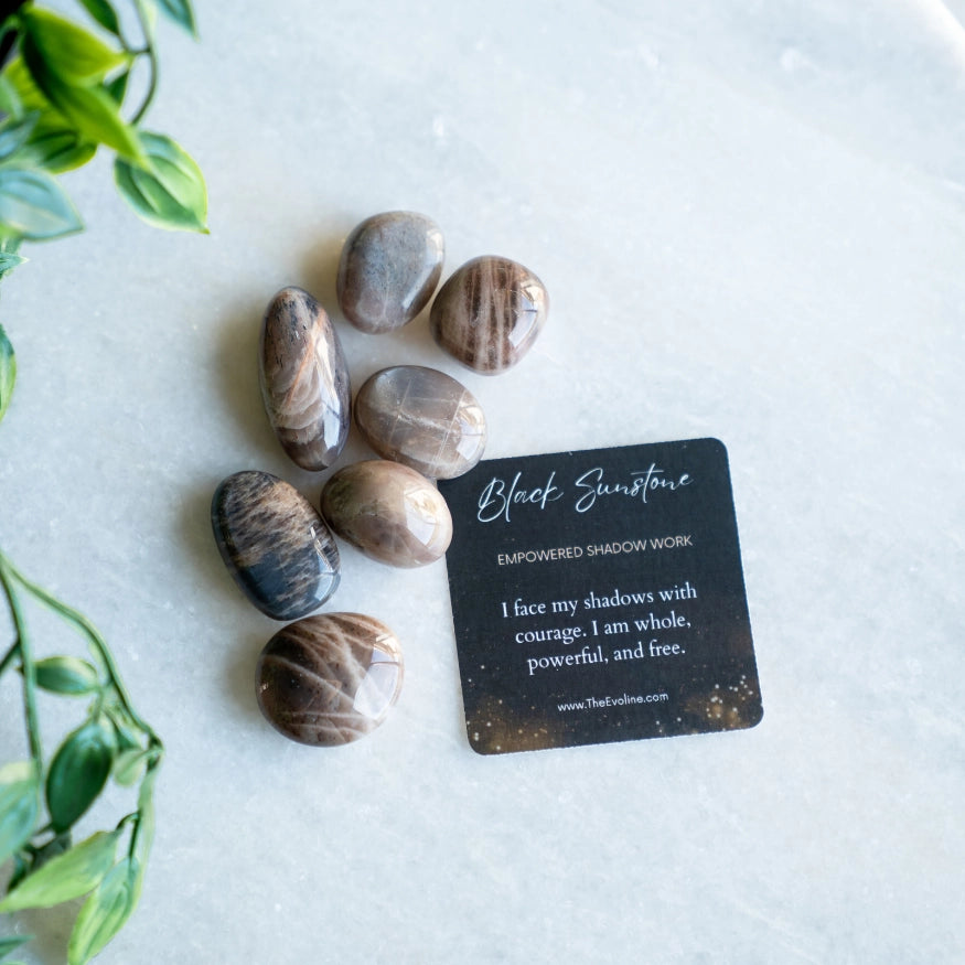 the evoline black sunstone tumbled stone with affrimation card