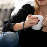 Rebekah wearing The Evoline Blue Kyanite energetic alignment and clear communication bracelet.