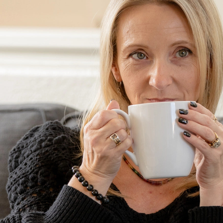 Rebekah wearing The Evoline Blue Tiger's Eye Inner Peace and Confidence Bracelet