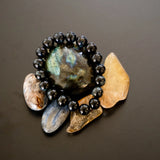 The Evoline Blue Tiger's Eye Inner Peace and Confidence Bracelet on natural elements