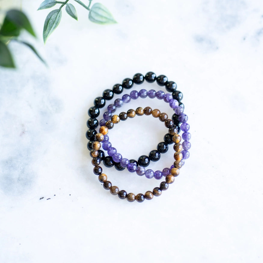 The Evoline Light Rising 3-Bracelet Stack: Black Tourmaline, Amethyst & Tiger’s Eye (Grounded Success)