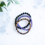 The Evoline Light Rising 3-Bracelet Stack: Black Tourmaline, Amethyst & Tiger’s Eye (Grounded Success)
