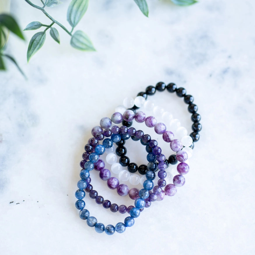 The Evoline Clearing & Grounding 5-Bracelet Stack: Black Tourmaline, Amethyst, Selenite, Lepidolite & Kyanite