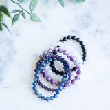 The Evoline Clearing & Grounding 5-Bracelet Stack: Black Tourmaline, Amethyst, Selenite, Lepidolite & Kyanite