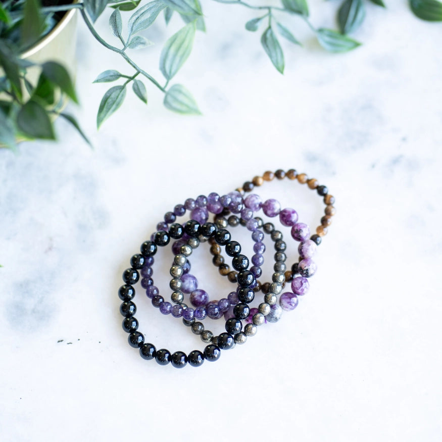 The Evoline Light Rising 5-Bracelet Stack: Black Tourmaline, Amethyst, Tiger’s Eye, Pyrite & Lepidolite