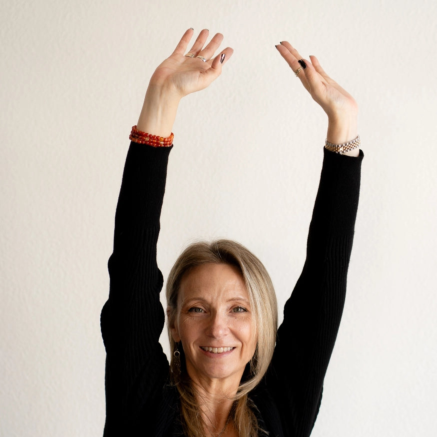 Rebekah wearing the Carnelian Bracelet as a stack style. The Evoline Carnelian Courage & Bold Action Bracelet, healing energy bracelets, bracelet stacks