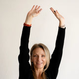 Rebekah wearing the Carnelian Bracelet as a stack style. The Evoline Carnelian Courage & Bold Action Bracelet, healing energy bracelets, bracelet stacks