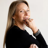 Rebekah wearing The Evoline Labradorite bracelets in a stacked style.