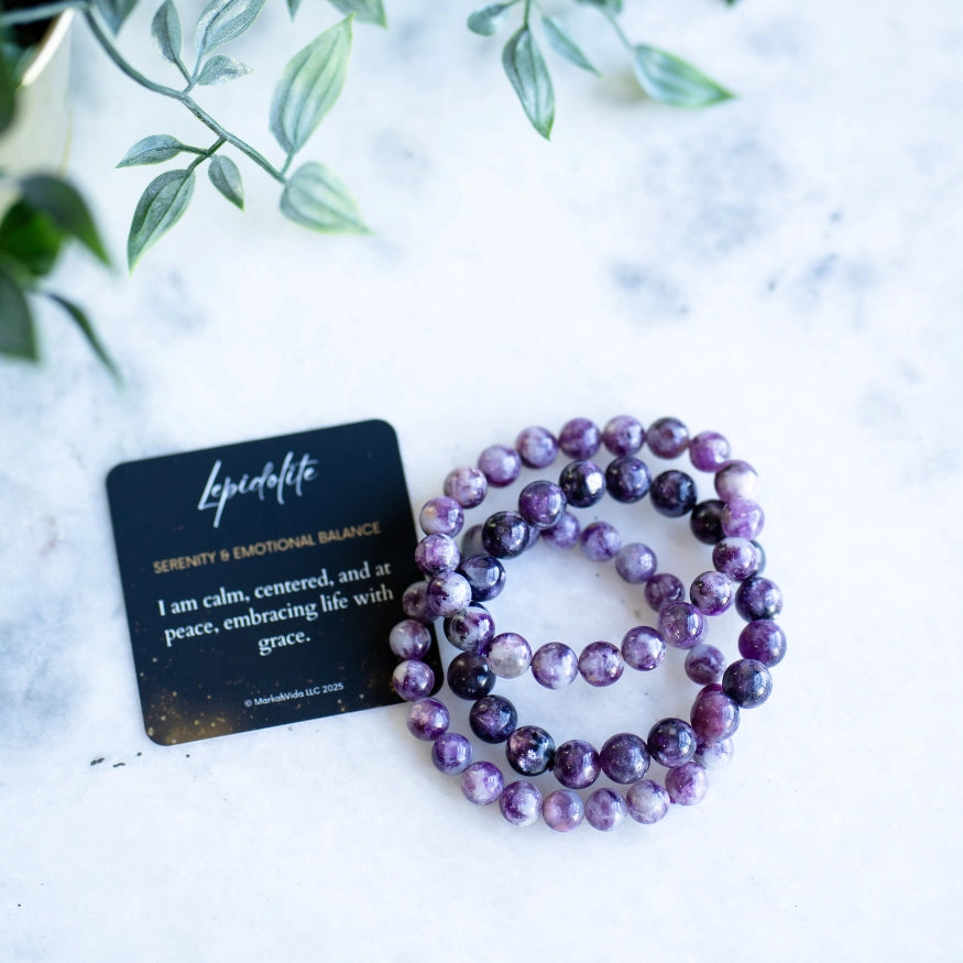 The Evoline Lepidolite Serenity & Emotional Balance Bracelet with meaning and affirmation card.