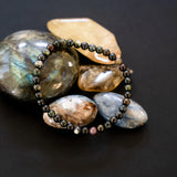 The Evoline Multi-Colored Tourmaline Bracelet shown on natural elements.