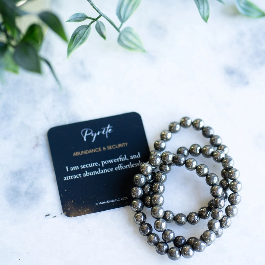 The Evoline Pyrite Abundance & Security Bracelet with affirmation card.