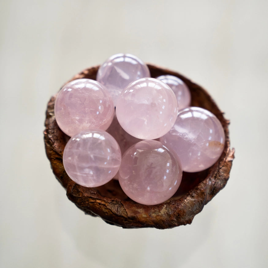 The Eoline Star Rose Quartz Unconditional Love & Inner Radiance Spheres in a bowl.