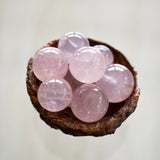 The Eoline Star Rose Quartz Unconditional Love & Inner Radiance Spheres in a bowl.