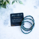 The Evoline Ruby in Kyanite Purpose & Expression Bracelets with Affirmation card.