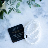 The Evoline Selenite Cleansing & Higher Light Connection Bracelet stacked with affirmation card.