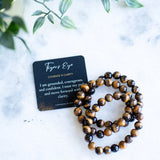The Evoline Tigers Eye Courage and Clarity Bracelets shown with an affirmation card.