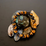 The Evoline Tigers Eye Courage and Clarity Bracelets on natural stones.