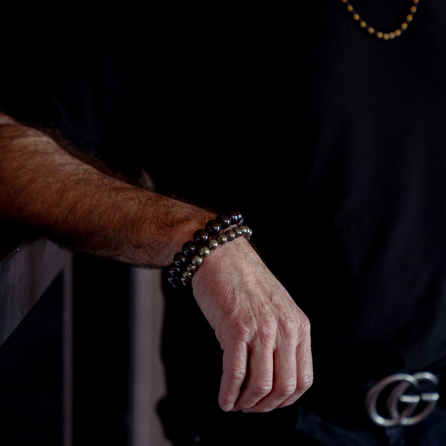 Male wearing a Garnet Bracelet from The Evoline