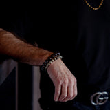 Male wearing a Garnet Bracelet from The Evoline