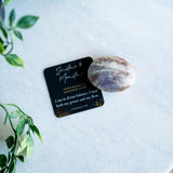 Sunstone & moonstone palm stone from the evoline with an affrimation card